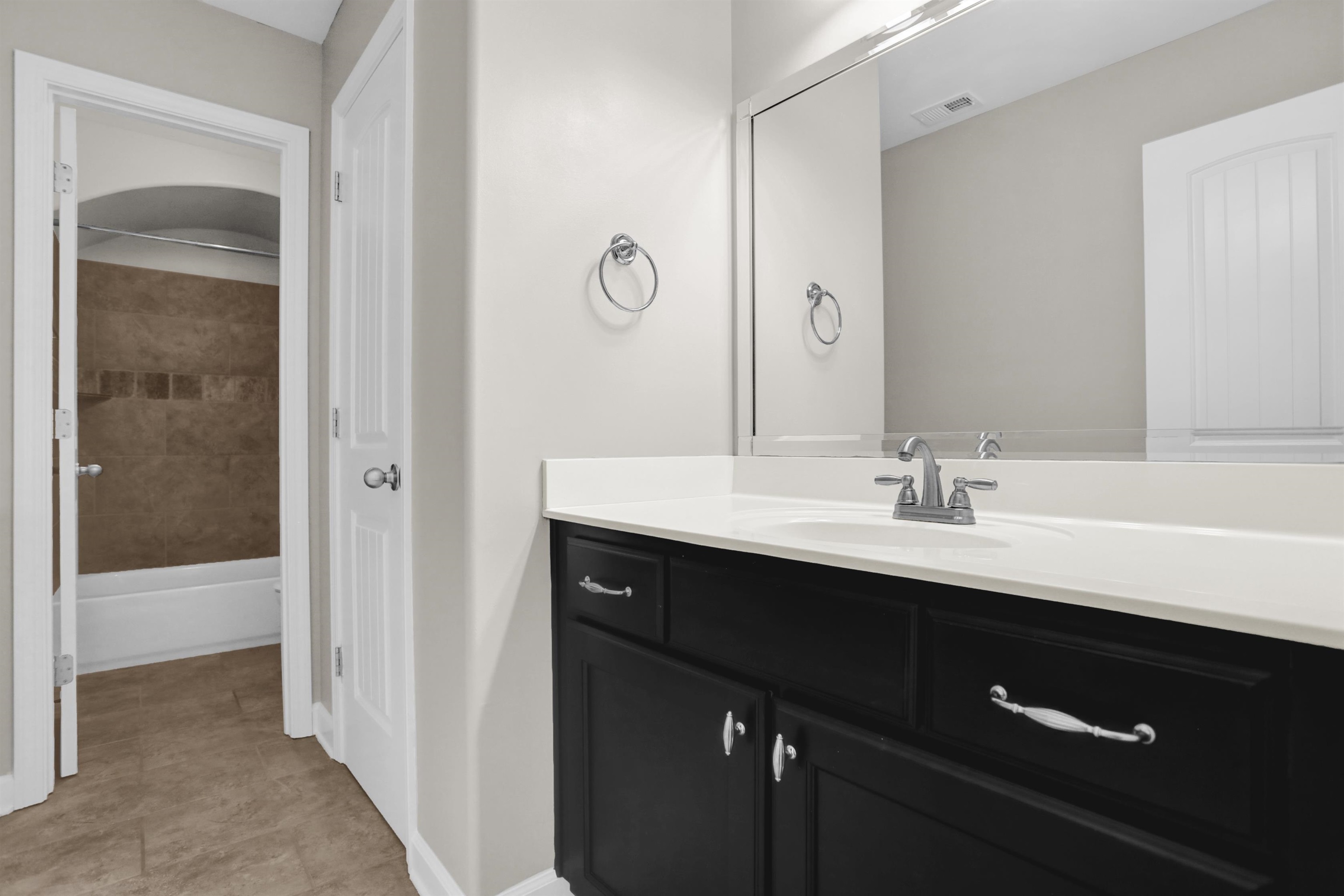 25 Breezy Loop Oakland, TN 38060 - Photo 16 of 19 a bathroom with a sink and a mirror