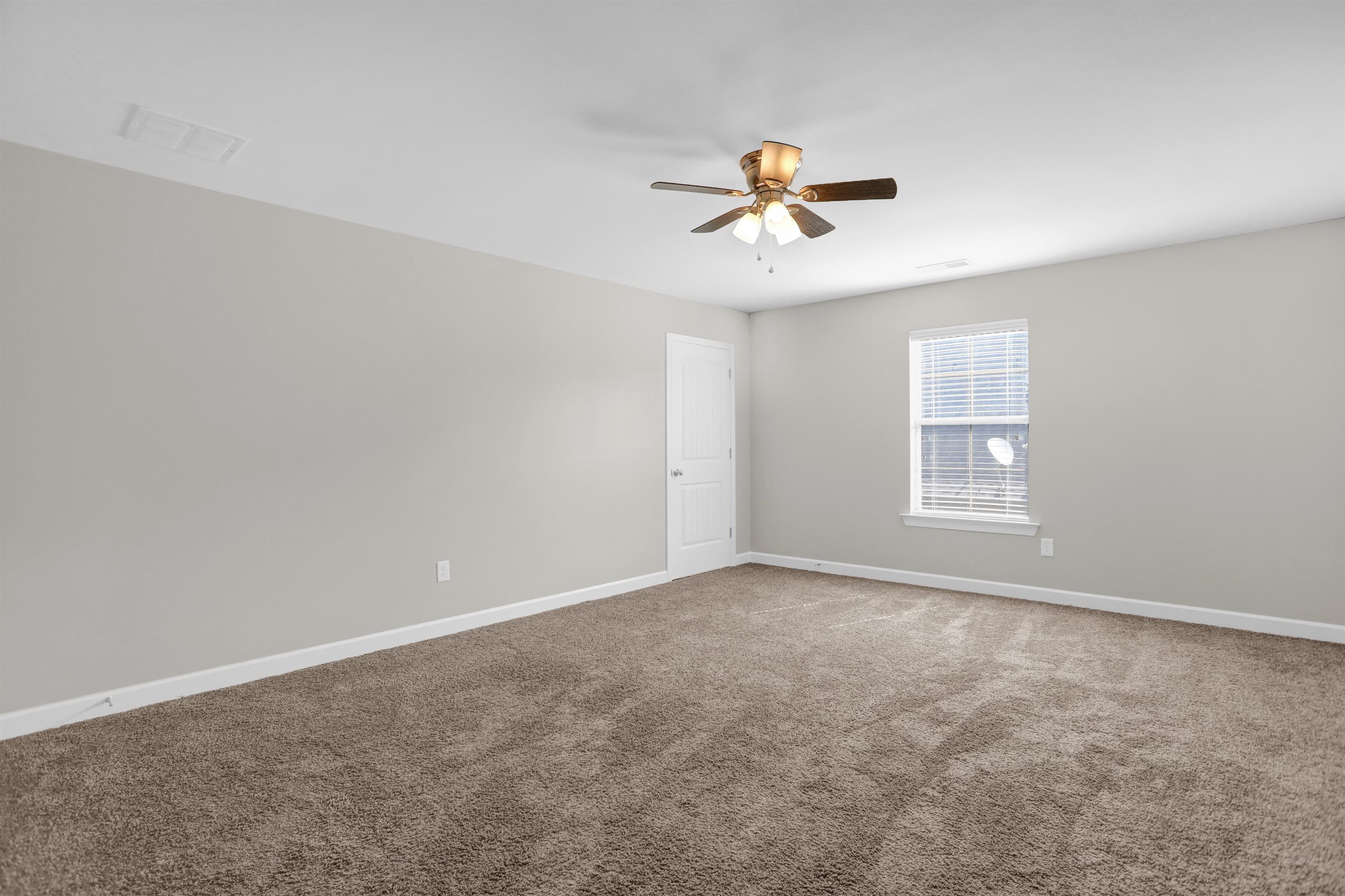 25 Breezy Loop Oakland, TN 38060 - Photo 17 of 19 a view of a room with a ceiling fan and window