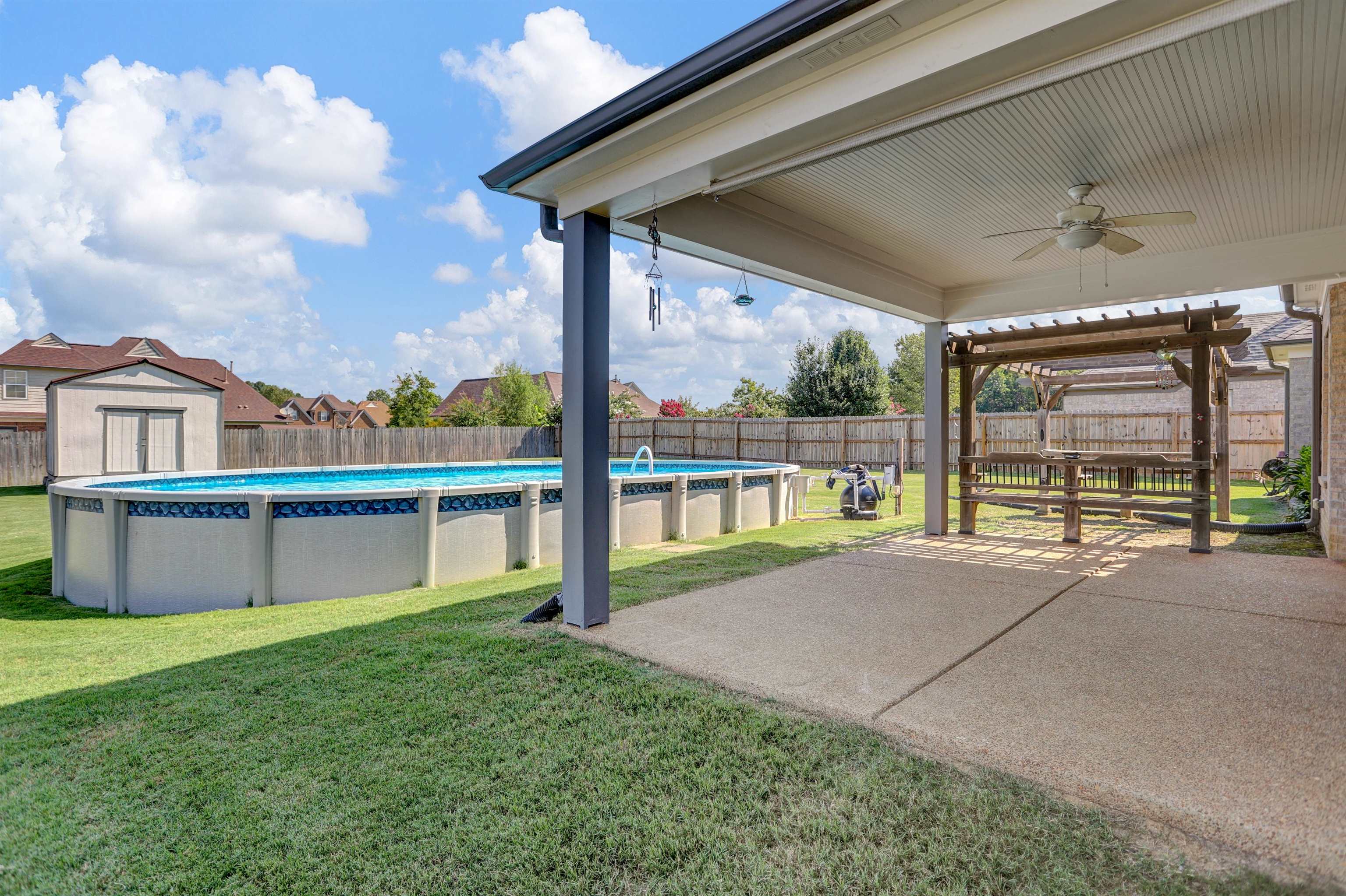 25 Breezy Loop Oakland, TN 38060 - Photo 18 of 19 a view of an house with backyard and porch