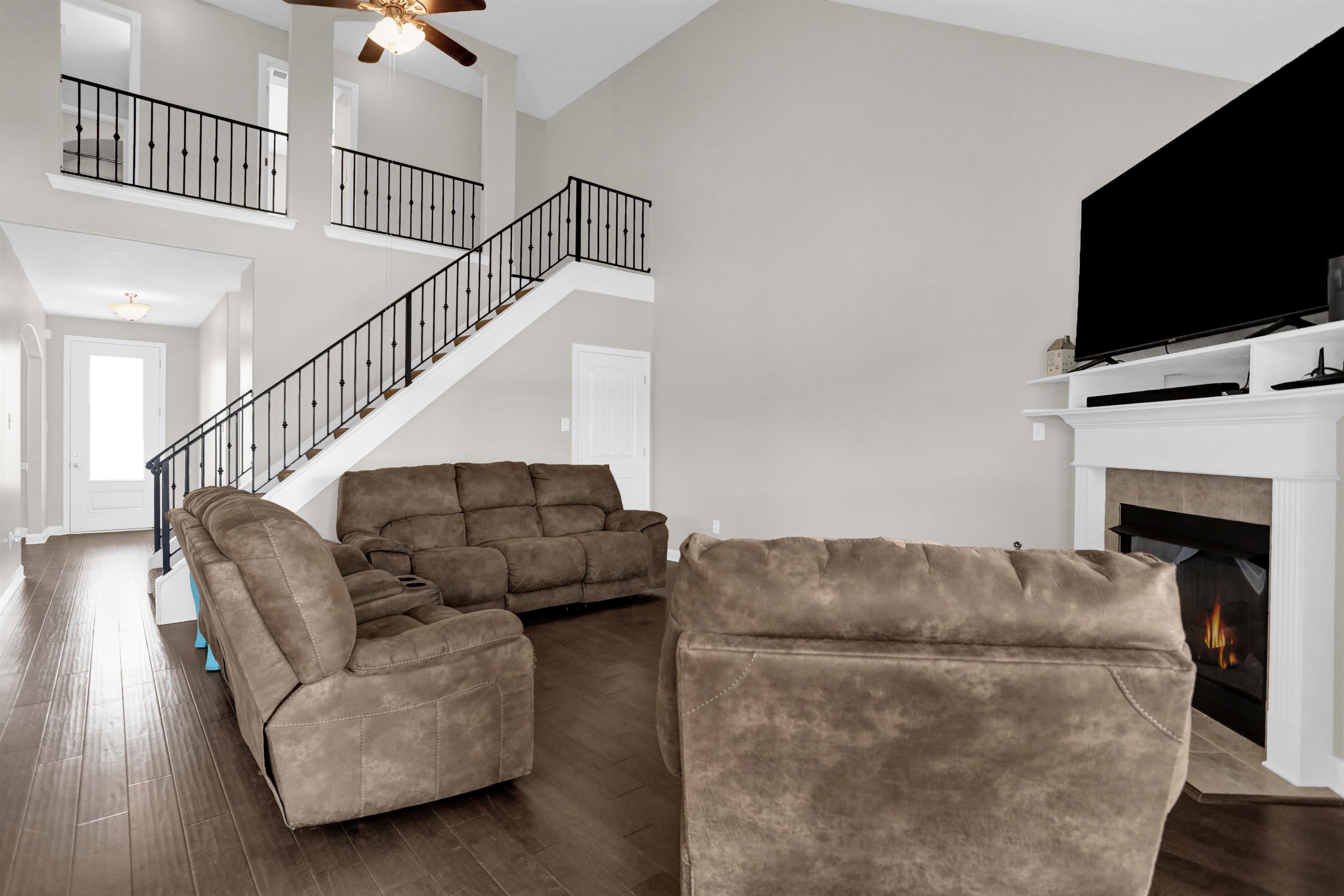 25 Breezy Loop Oakland, TN 38060 - Photo 3 of 19 a living room with furniture flat screen tv and a fireplace
