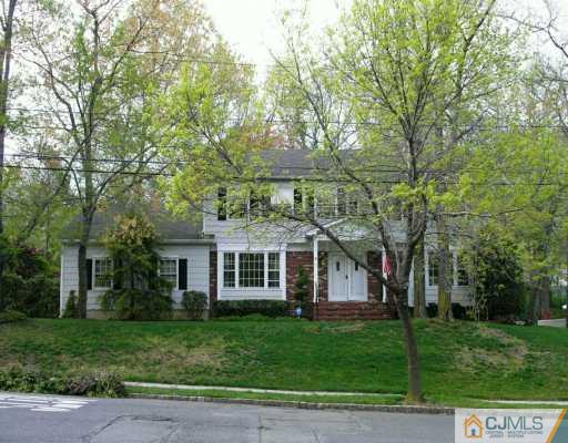 21 Thomas Road East Brunswick, NJ 08816 - Photo 1 of 8 front view of a house with a yard