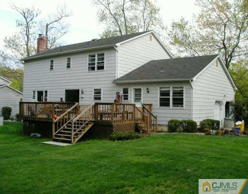 21 Thomas Road East Brunswick, NJ 08816 - Photo 2 of 8 a view of a house with backyard