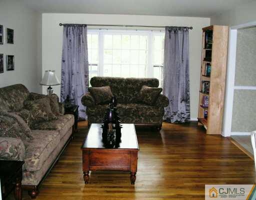 21 Thomas Road East Brunswick, NJ 08816 - Photo 4 of 8 a living room with furniture and wooden floor