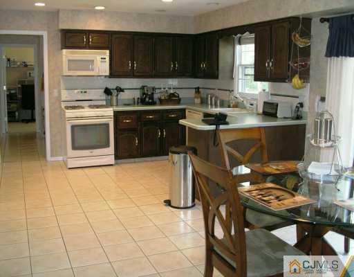 21 Thomas Road East Brunswick, NJ 08816 - Photo 8 of 8 a kitchen with a sink and cabinets