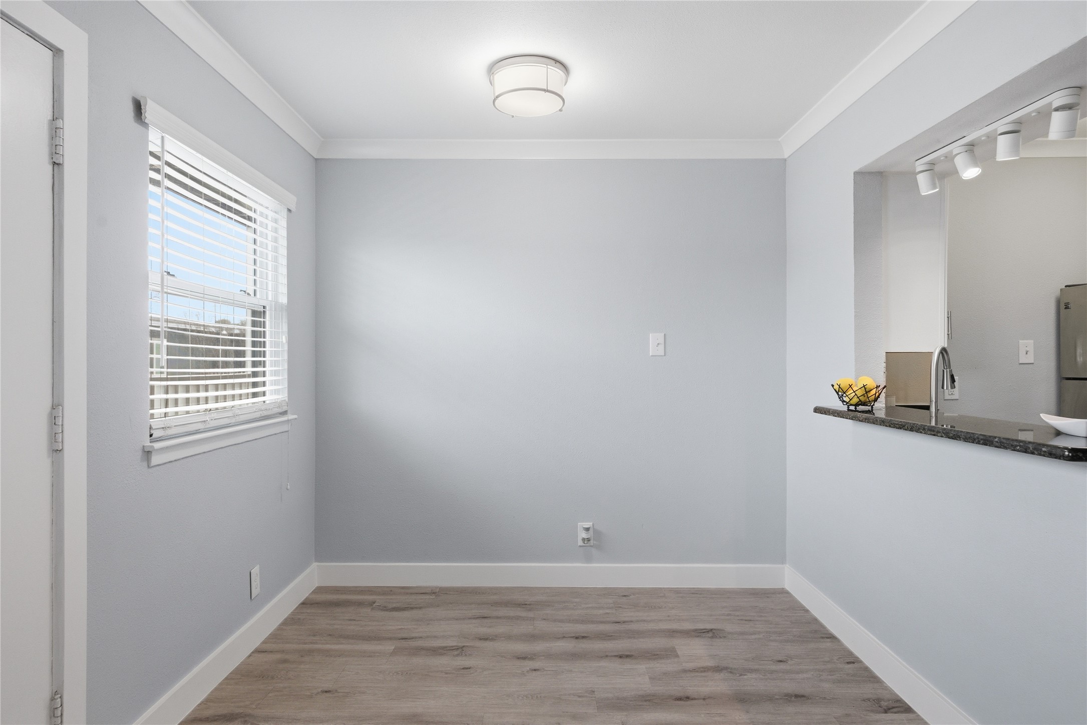 2401 Manor Road, Unit 232 Austin, TX 78722 - Photo 3 of 32 Unfurnished dining area featuring ornamental molding