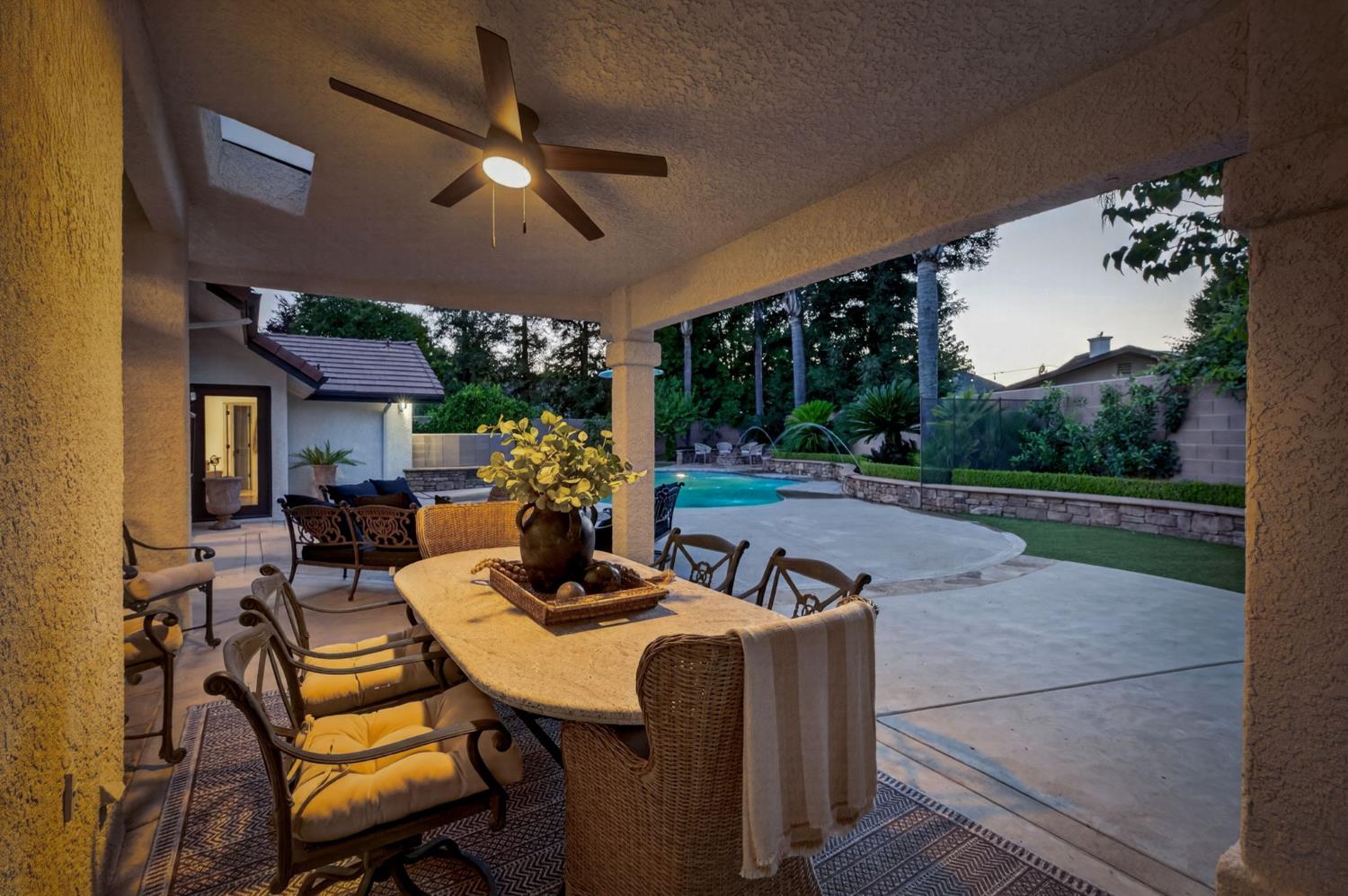 601 Decatur Avenue Clovis, CA 93611 - Photo 47 of 62 a view of a patio with a dining table and chairs