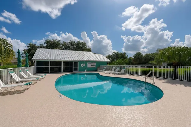 a view of a swimming pool with a patio