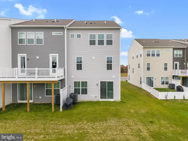 a front view of a building with a garden