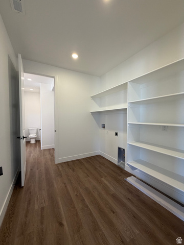4956 North 925 East, Unit 87 Enoch, UT 84721 - Photo 8 of 19 Dedicated laundry area with wood-finish flooring, recessed lighting, and white built-in shelving