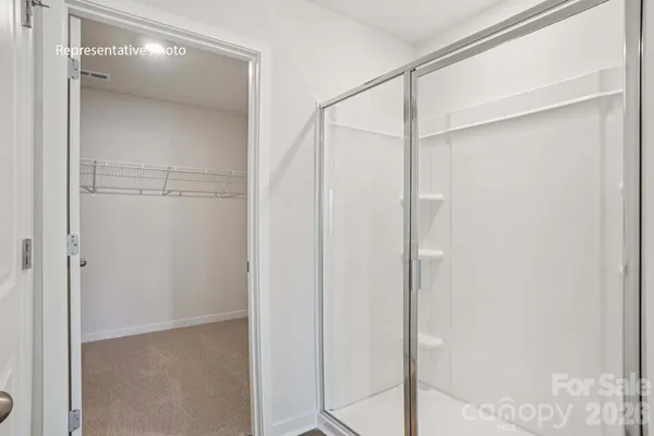 a bathroom with a granite countertop toilet a sink and a bathtub