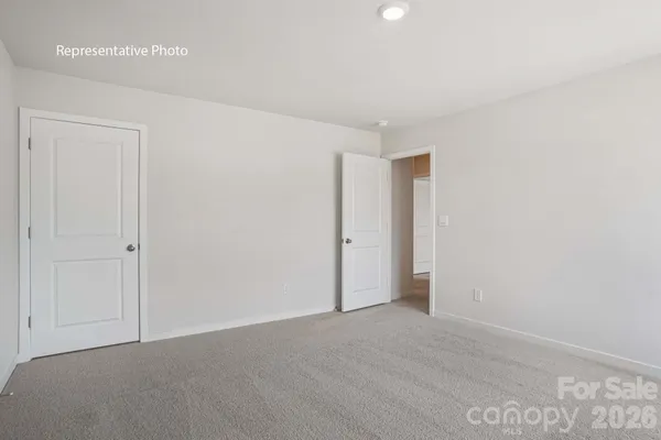 a front view of a building with a garden