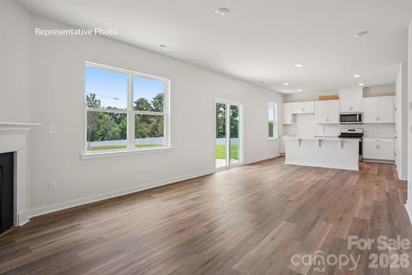 a view of kitchen with wooden floor and windows