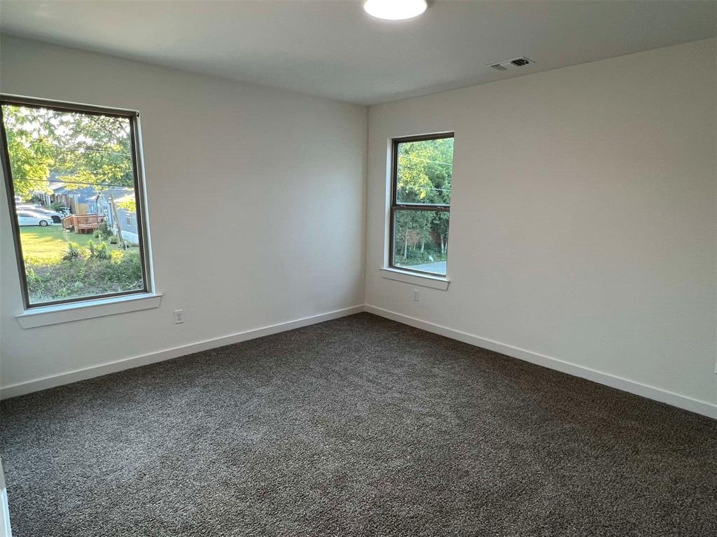 2526 South Fannin Avenue Denison, TX 75020 - Photo 9 of 20 an empty room with windows