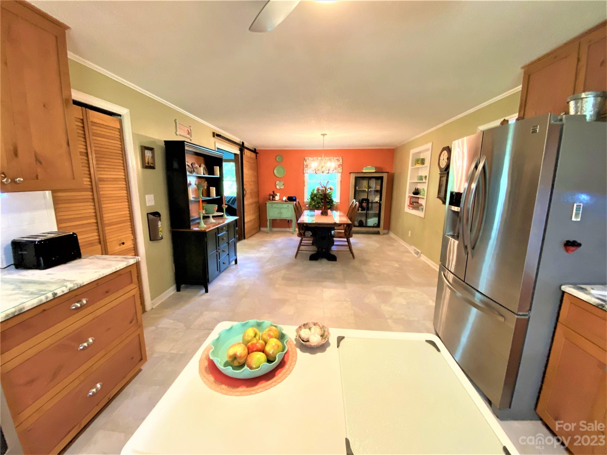 1203 Zeb Helms Road Monroe, NC 28112 - Photo 12 of 46 a kitchen with stainless steel appliances granite countertop a refrigerator and a stove