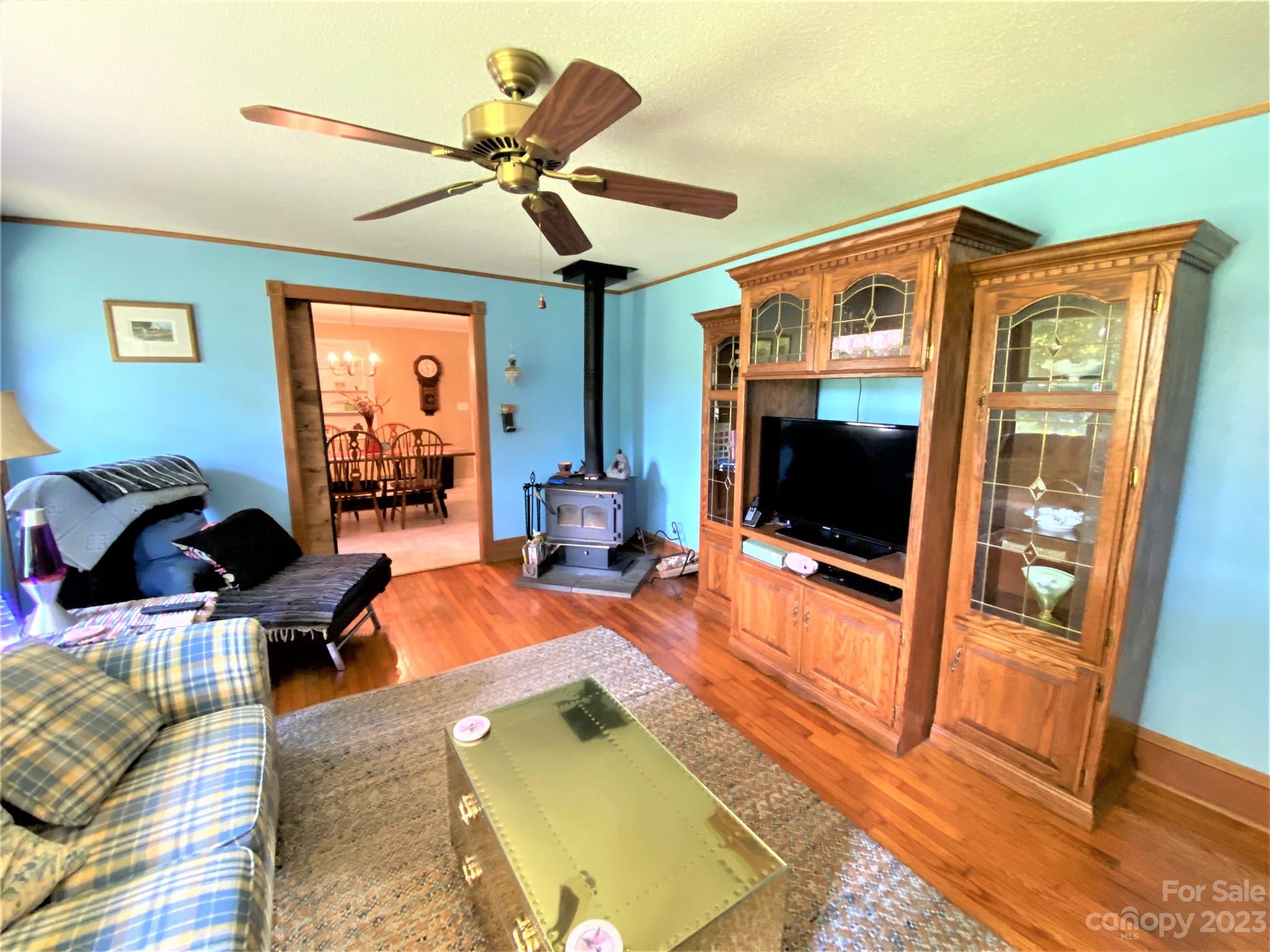 1203 Zeb Helms Road Monroe, NC 28112 - Photo 19 of 46 a living room with furniture and a flat screen tv