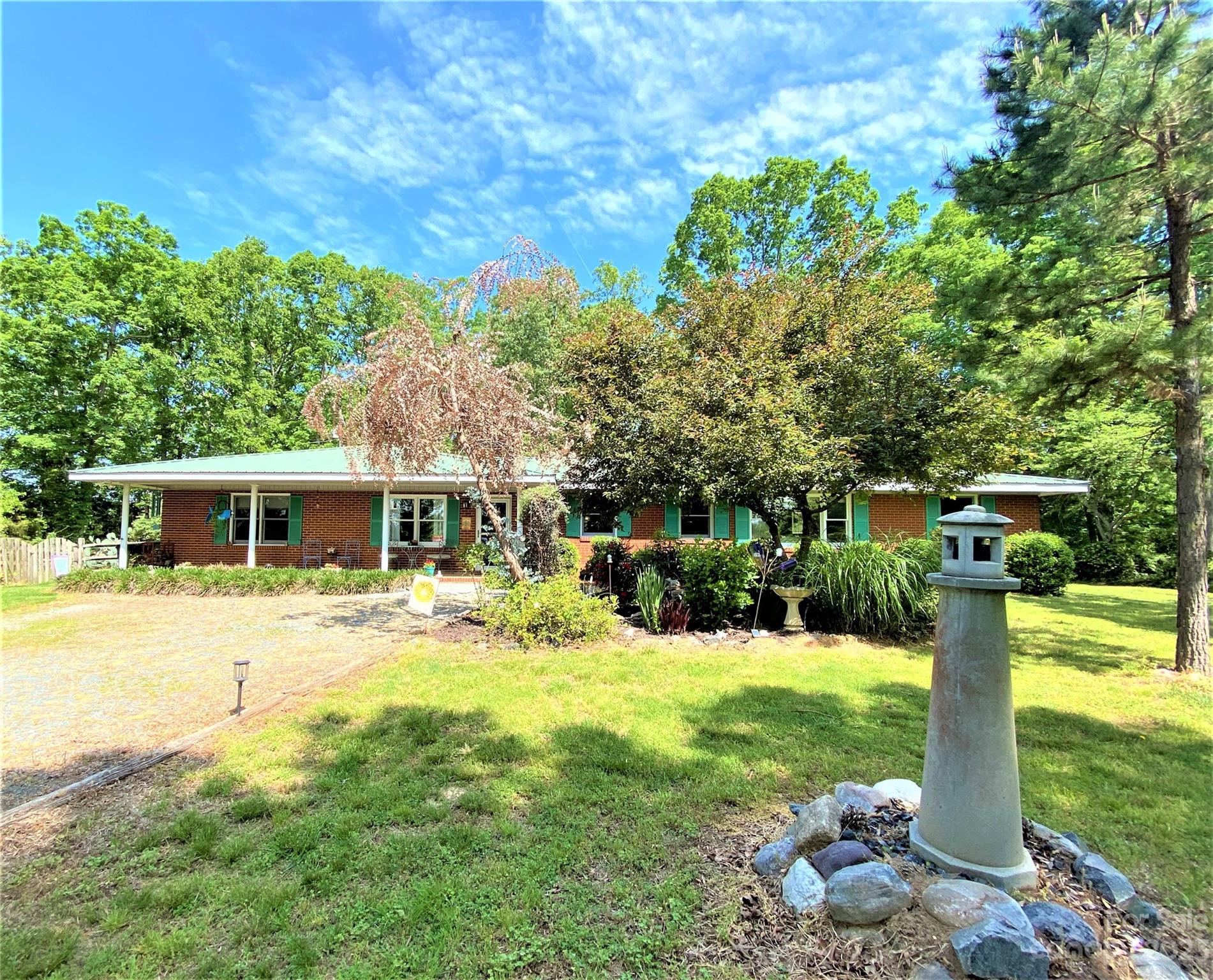 1203 Zeb Helms Road Monroe, NC 28112 - Photo 3 of 46 a front view of a house with yard and green space