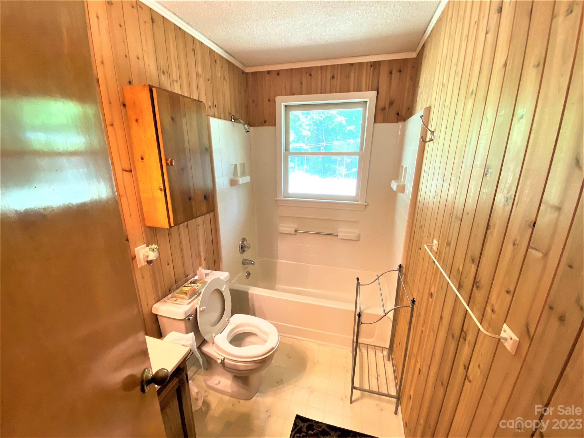 1203 Zeb Helms Road Monroe, NC 28112 - Photo 37 of 46 a bathroom with a sink a toilet and tub