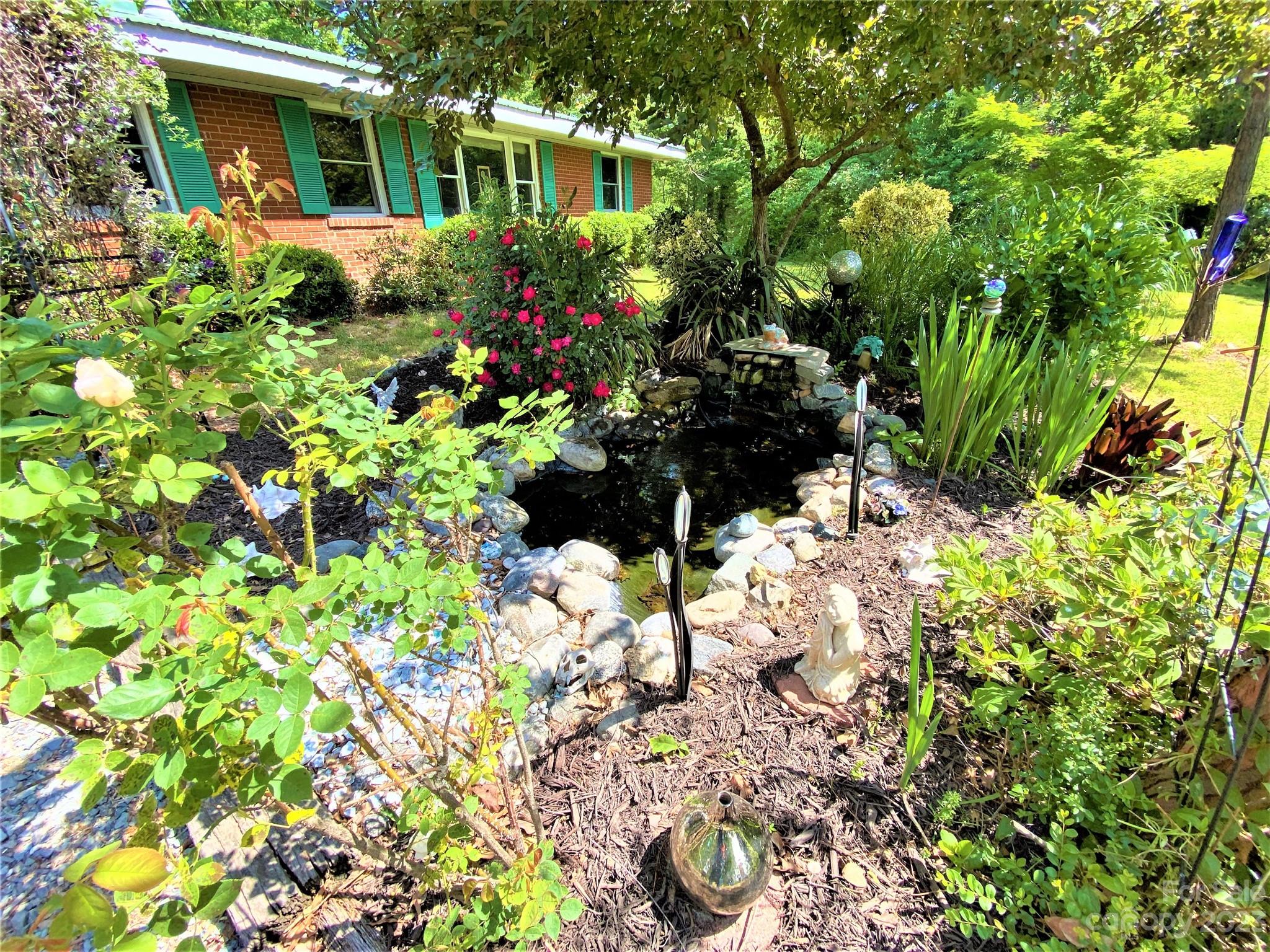 1203 Zeb Helms Road Monroe, NC 28112 - Photo 4 of 46 a view of a garden with a flower garden