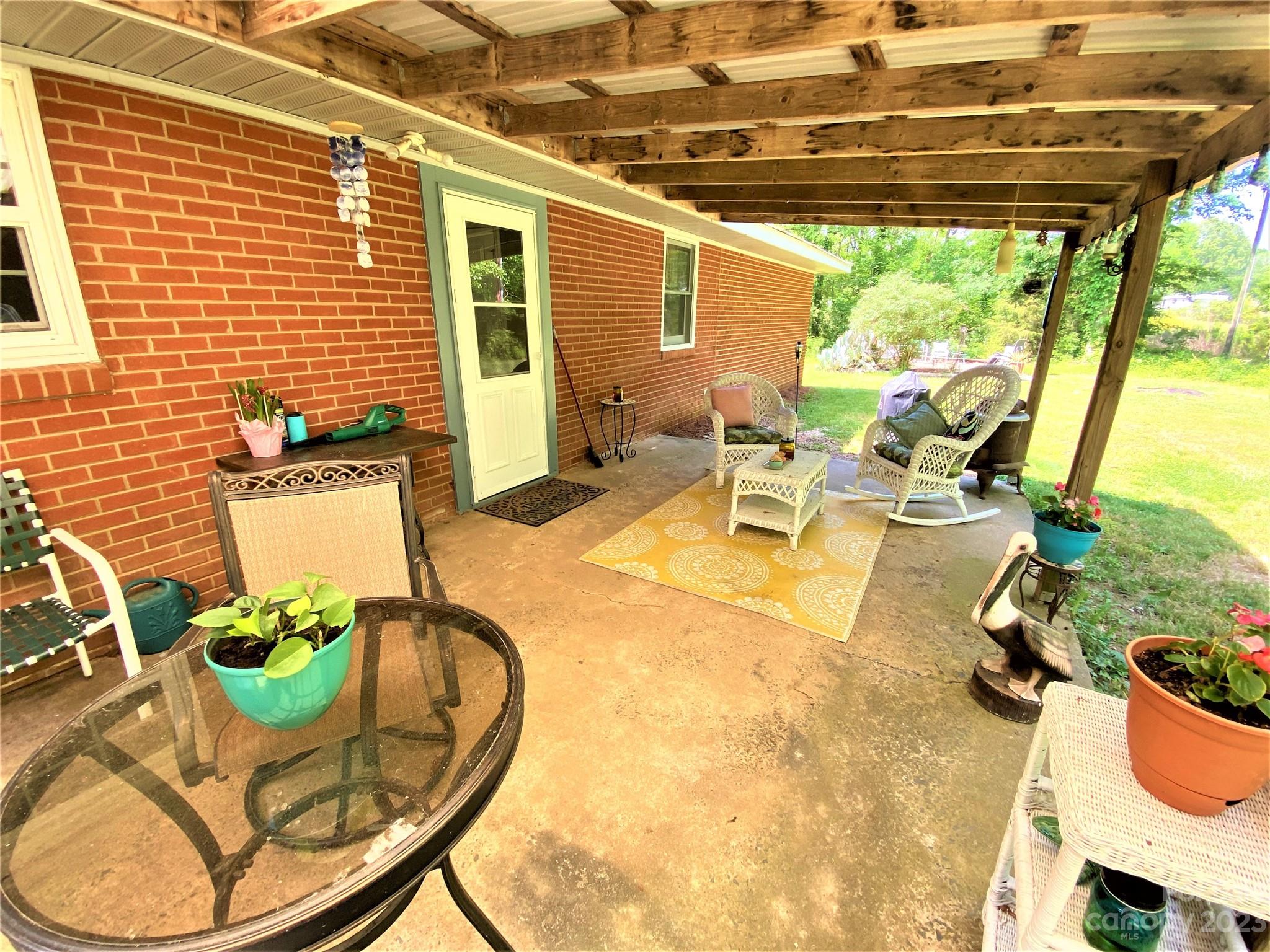 1203 Zeb Helms Road Monroe, NC 28112 - Photo 43 of 46 a view of a patio with table and chairs