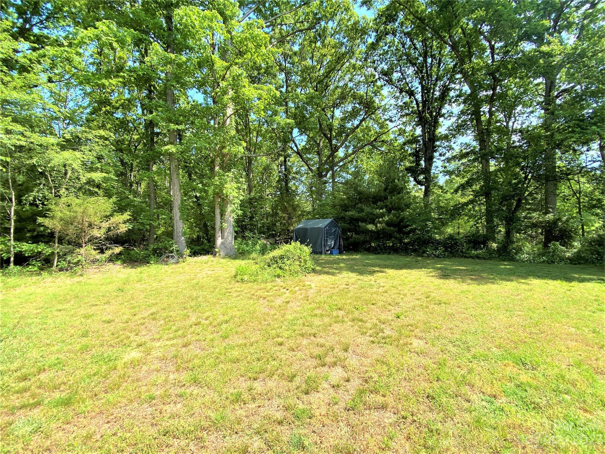 1203 Zeb Helms Road Monroe, NC 28112 - Photo 46 of 46 a view of a swimming pool with an outdoor space