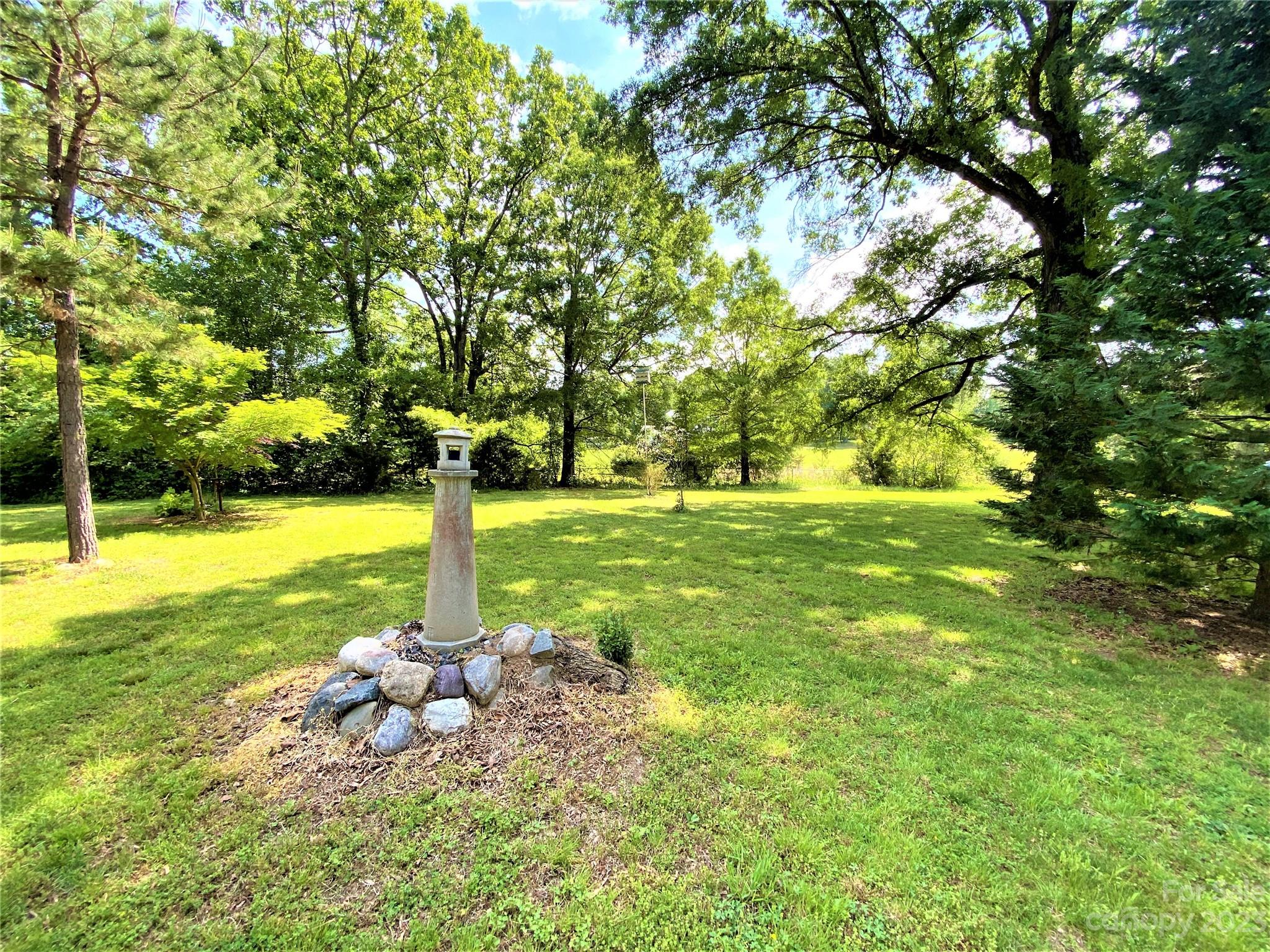 1203 Zeb Helms Road Monroe, NC 28112 - Photo 6 of 46 a view of a park with large trees