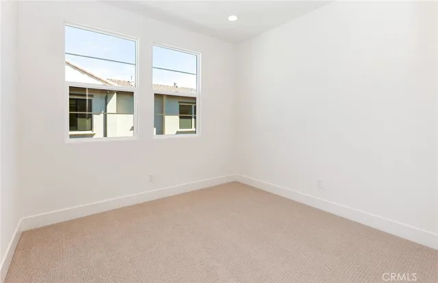 a bathroom with a toilet a sink a mirror and bathtub
