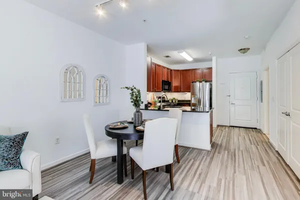 a view of kitchen with cabinets and wooden floor