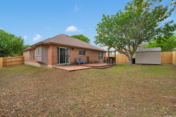 a front view of house with yard and trees