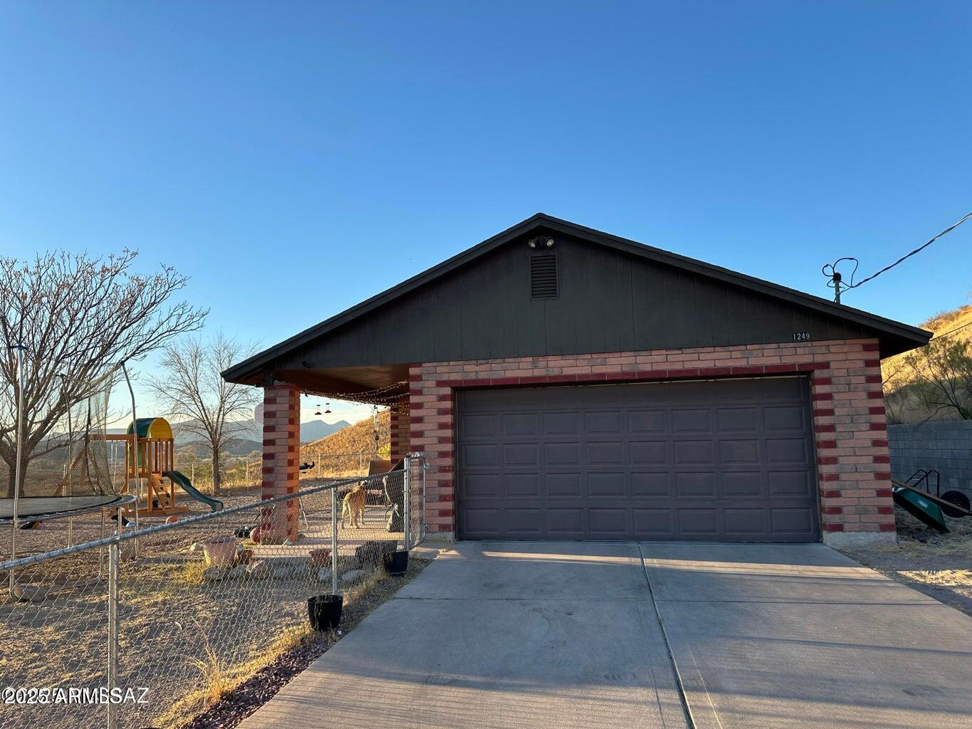 1249 Pendleton Drive Rio Rico, AZ 85648 - Photo 1 of 14 Subject Front