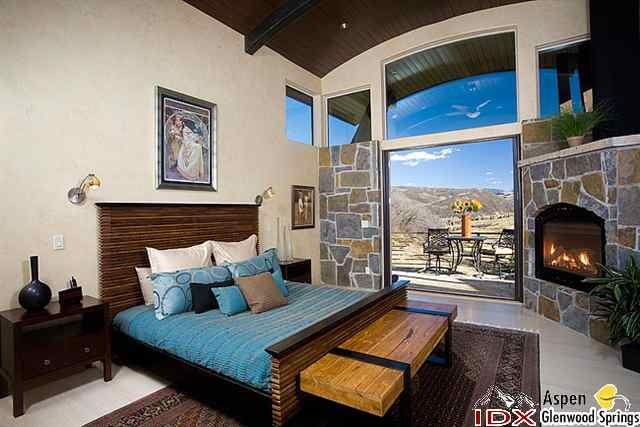 415 Meadow Road, Unit MELTON RANCH Snowmass Village, CO 81615 - Photo 11 of 18 a bed sitting in a bedroom next to a window