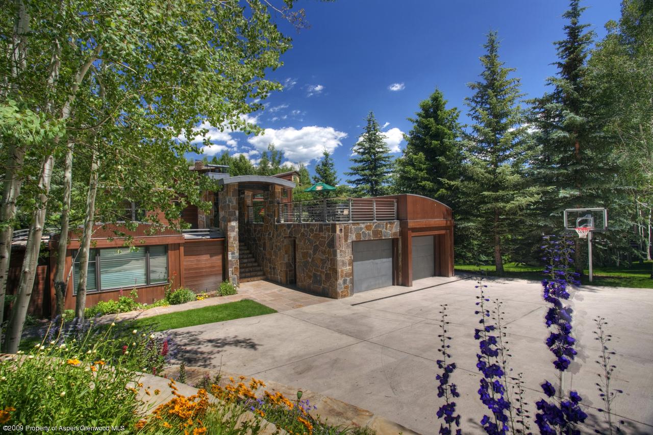 415 Meadow Road, Unit MELTON RANCH Snowmass Village, CO 81615 - Photo 14 of 18 a street view with a building in the background