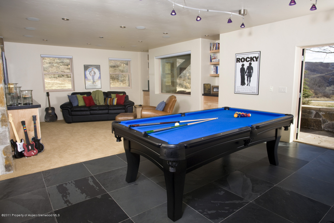 415 Meadow Road, Unit MELTON RANCH Snowmass Village, CO 81615 - Photo 15 of 18 a room with pool table and windows