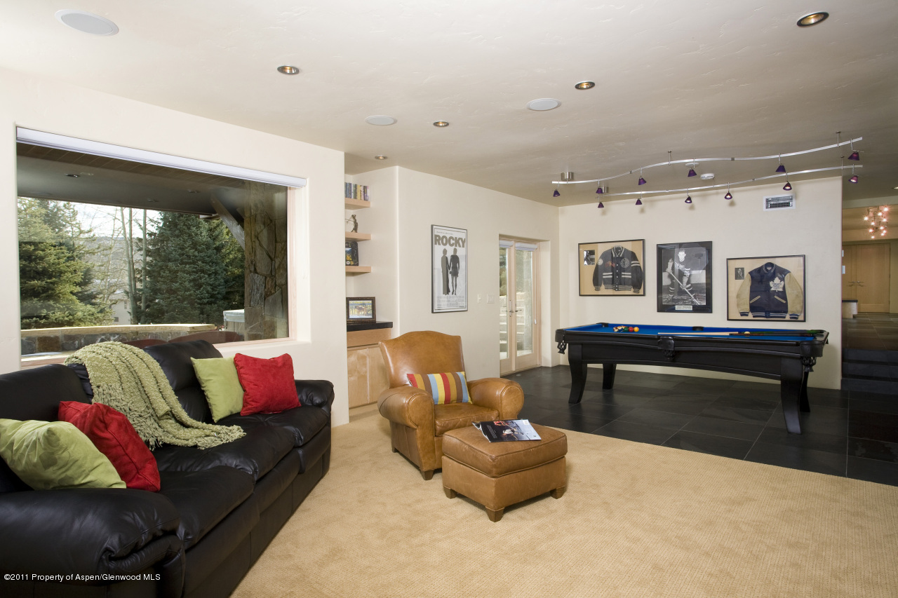 415 Meadow Road, Unit MELTON RANCH Snowmass Village, CO 81615 - Photo 16 of 18 a living room with furniture and a large window