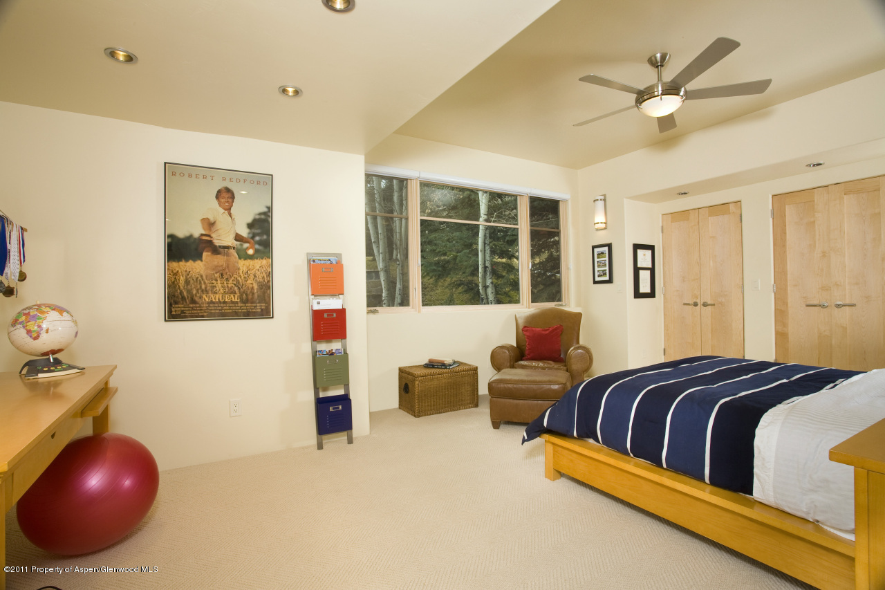 415 Meadow Road, Unit MELTON RANCH Snowmass Village, CO 81615 - Photo 18 of 18 a bedroom with a large bed and a large window