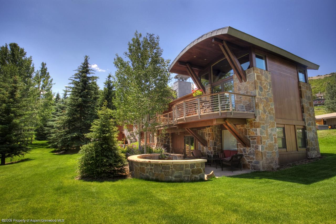 415 Meadow Road, Unit MELTON RANCH Snowmass Village, CO 81615 - Photo 3 of 18 a front view of a house with a yard