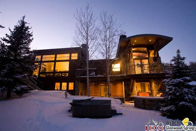 415 Meadow Road, Unit MELTON RANCH Snowmass Village, CO 81615 - Photo 4 of 18 a roof deck with table and chairs and potted plants