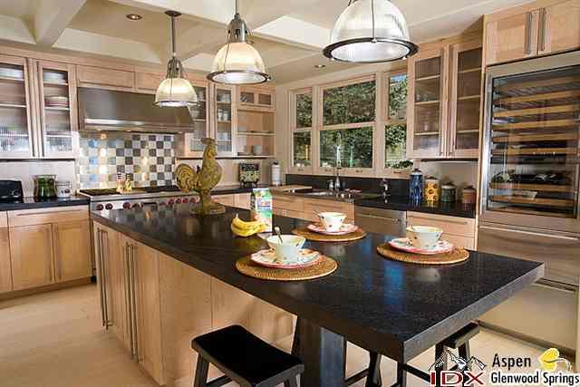 415 Meadow Road, Unit MELTON RANCH Snowmass Village, CO 81615 - Photo 5 of 18 a kitchen with a dining table and chairs