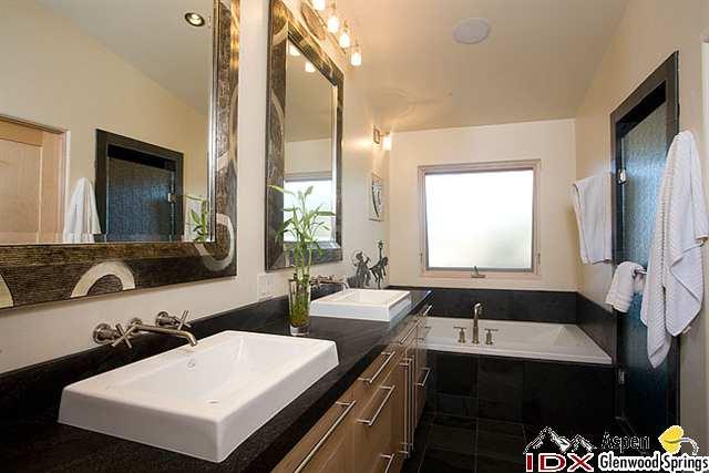 415 Meadow Road, Unit MELTON RANCH Snowmass Village, CO 81615 - Photo 7 of 18 a bathroom with a double vanity sink and a mirror