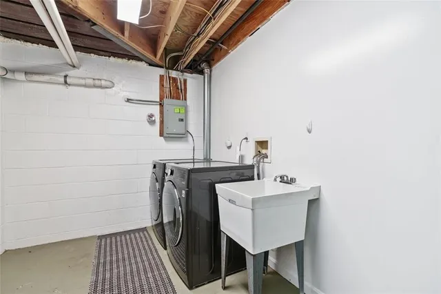 a bathroom with a sink a toilet and mirror