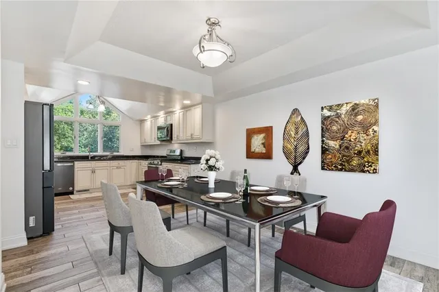 a view of a dining room with furniture window and wooden floor