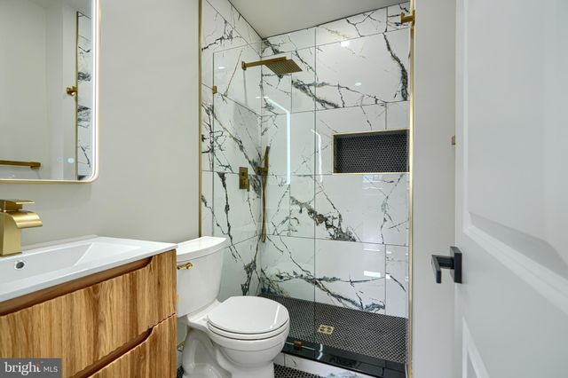a bathroom with a sink and mirror