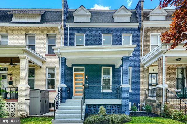 a view of balcony with deck and outdoor seating