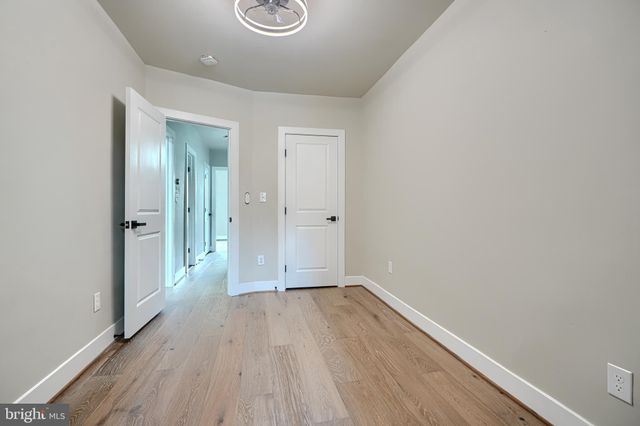 a bathroom with a shower sink and mirror