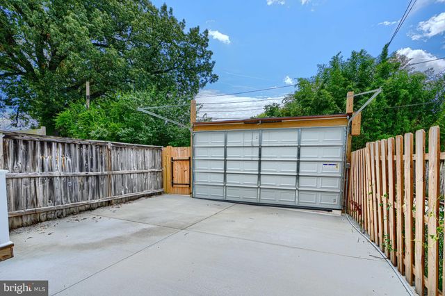 a view of a kitchen with furniture and a ceiling fan