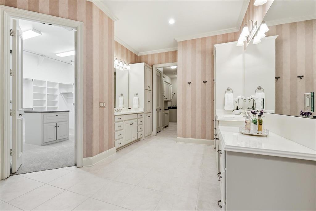 970 Crystal Cove Oak Point, TX 75068 - Photo 20 of 40 a bathroom with a double vanity sink mirror and shower