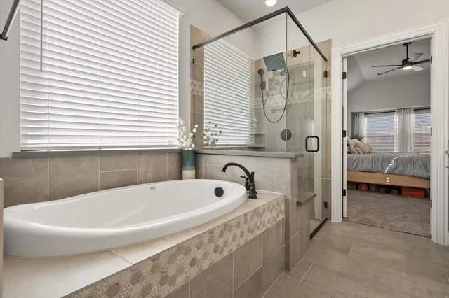 a bathroom with a bathtub and a shower