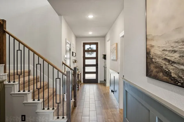 a view of a hallway with seating area