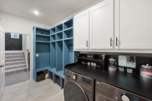 a kitchen with a refrigerator and cabinets