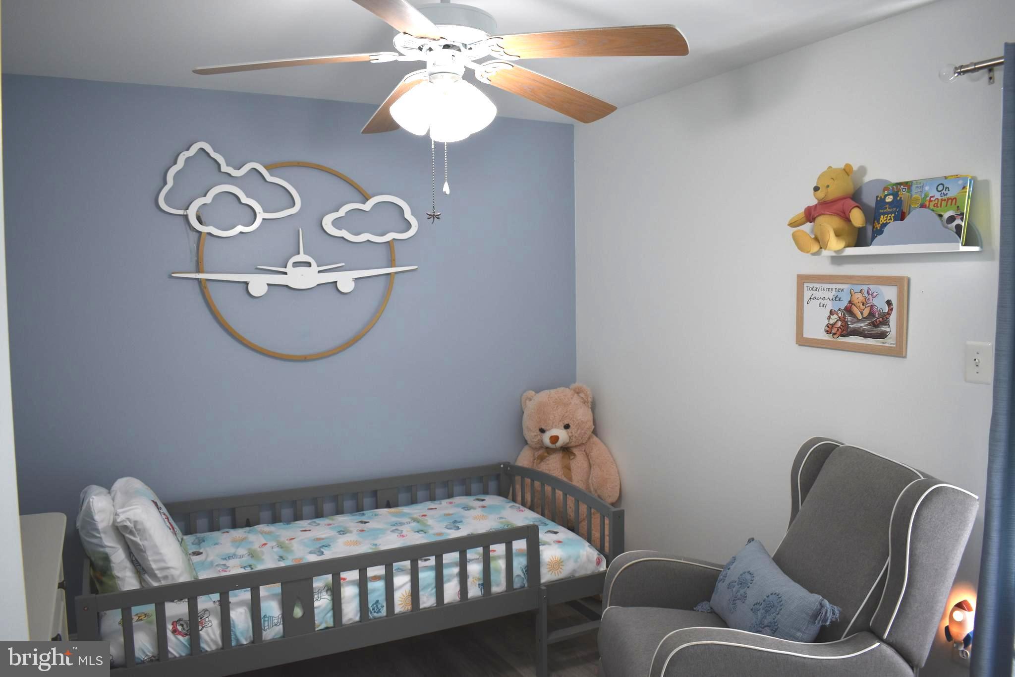 10958 Mountain Run Lake Road Culpeper, VA 22701 - Photo 20 of 31 a bedroom with a bed and a chandelier