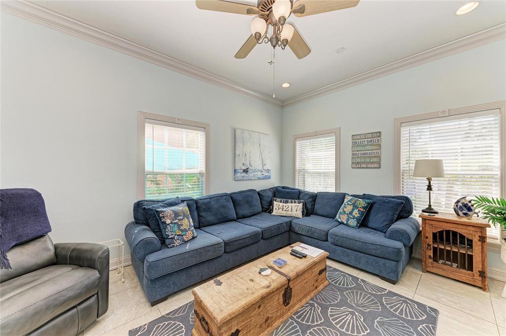 4003 5th Avenue Holmes Beach, FL 34217 - Photo 12 of 56 a living room with furniture a couch and window